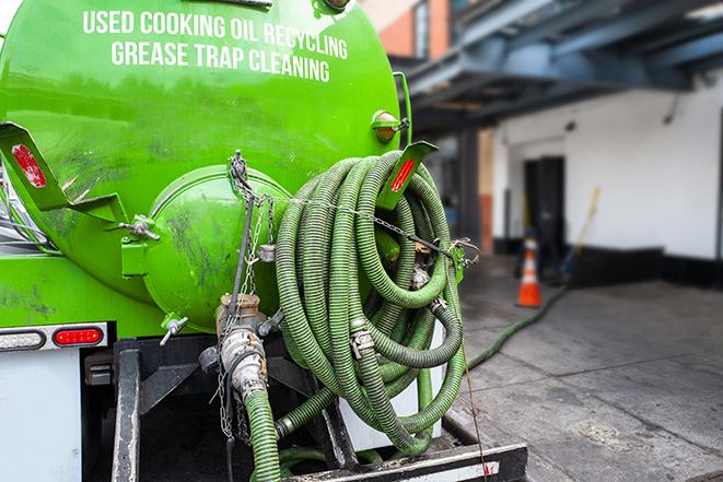 heavy-duty vacuum truck pumping out a grease trap in Clearwater